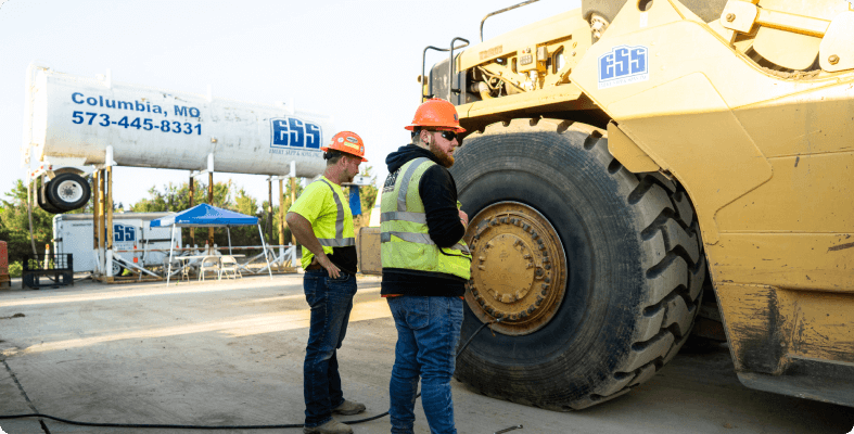 Excavator Operator and Technician Inspecting