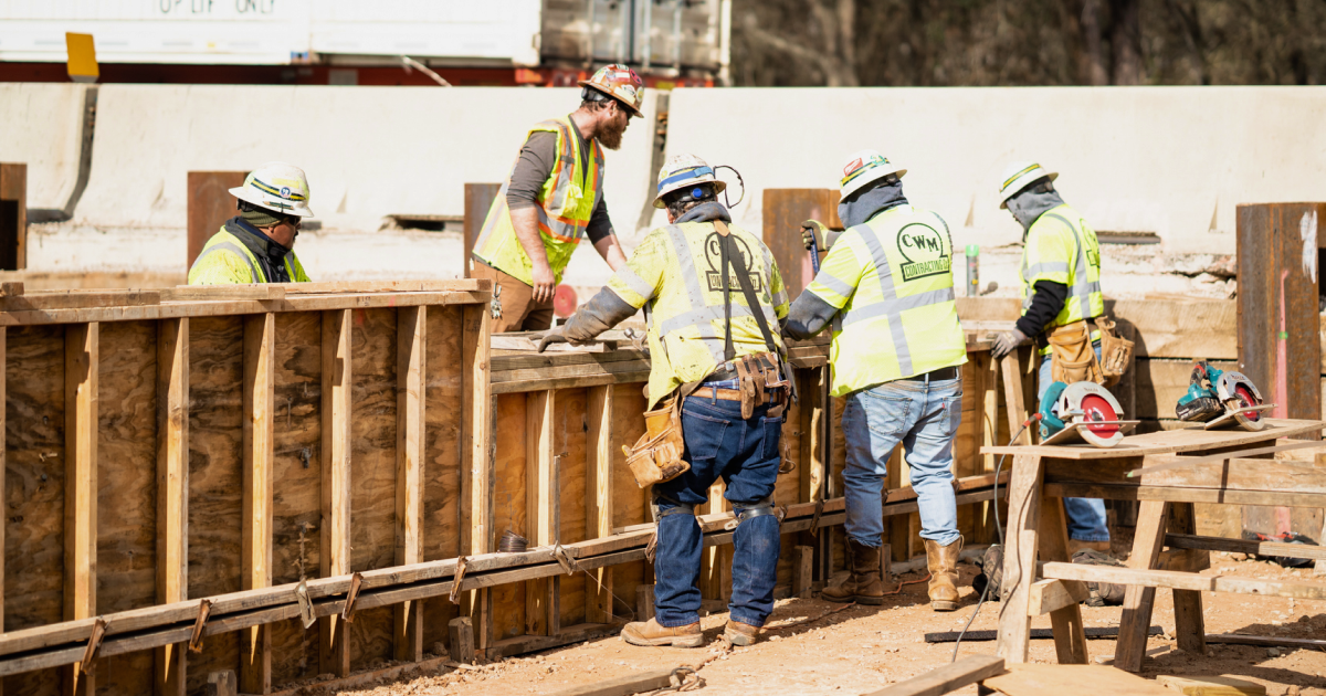 Crew building a wooden frame