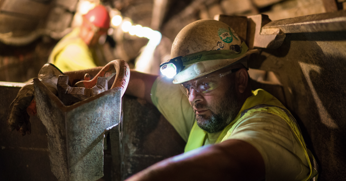 Man with hardhat and headlamp