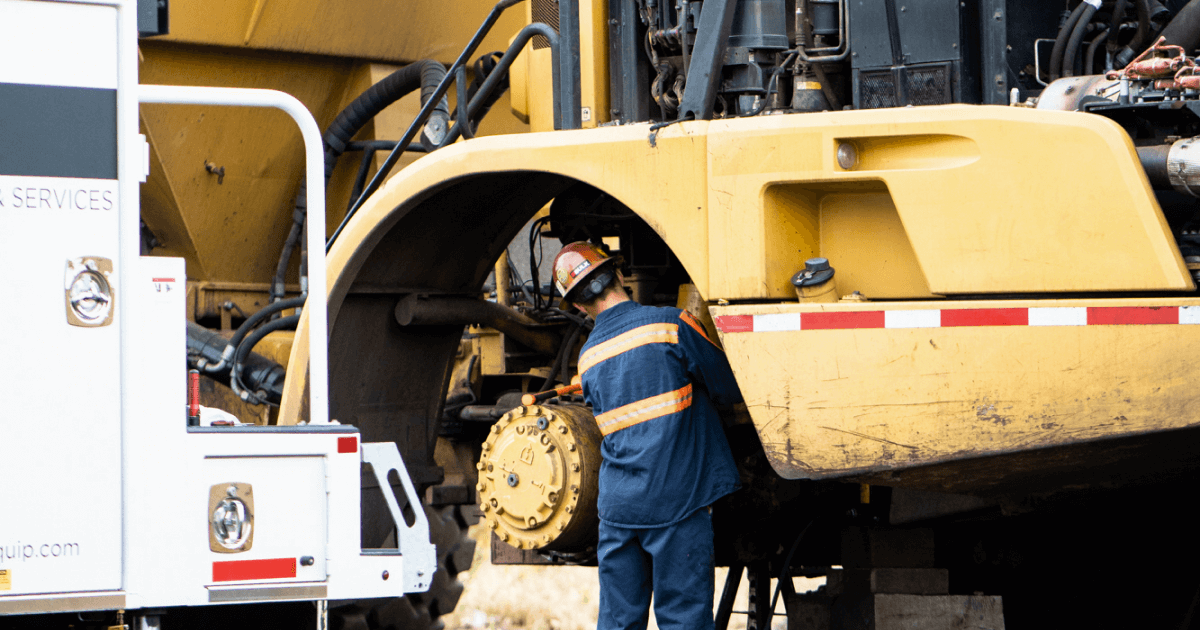 Equipment mechanic working on a machine