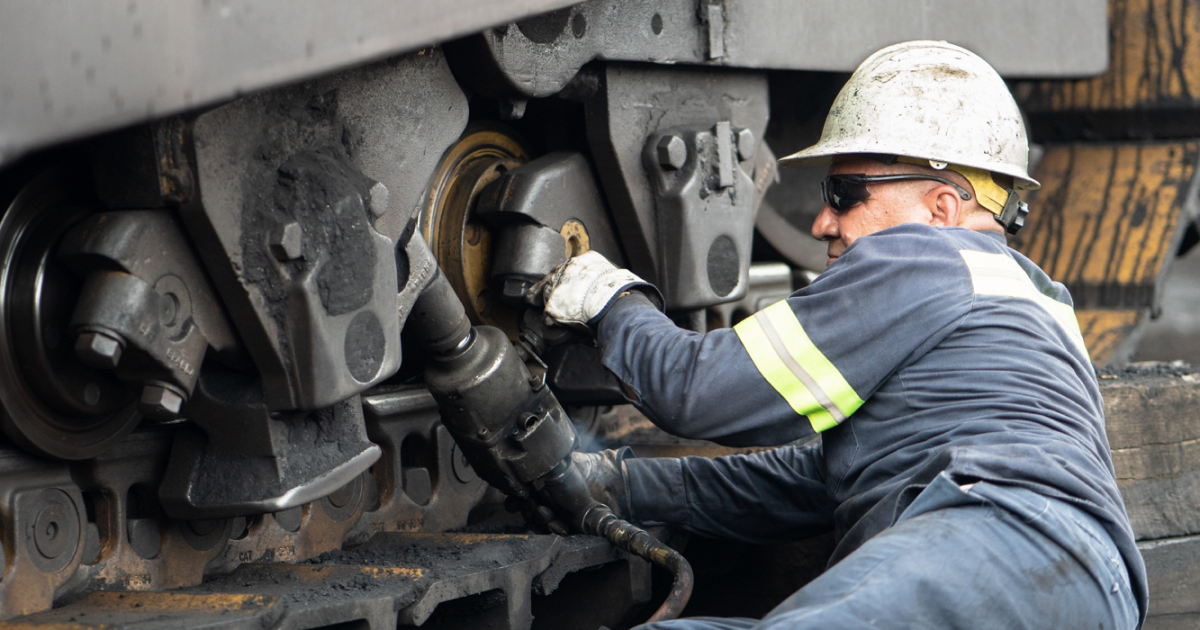 Mechanic fixing a machine