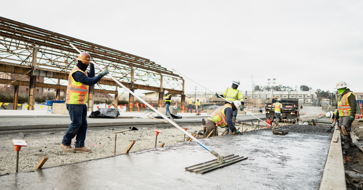 Crew finishing concrete