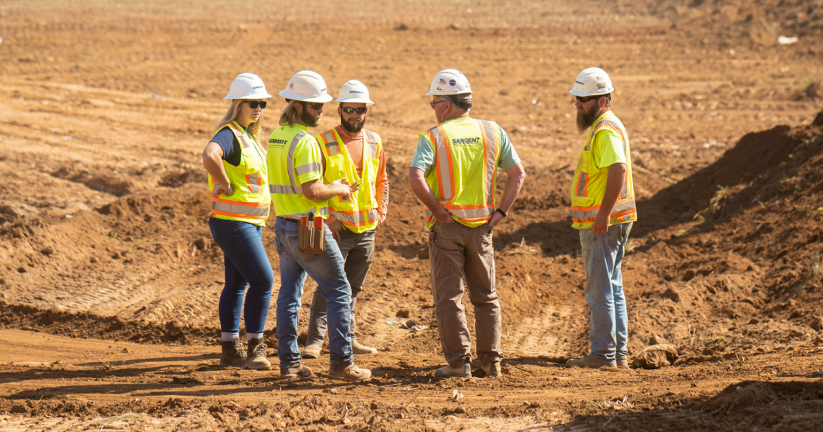 Supervisor instructing crew on a jobsite