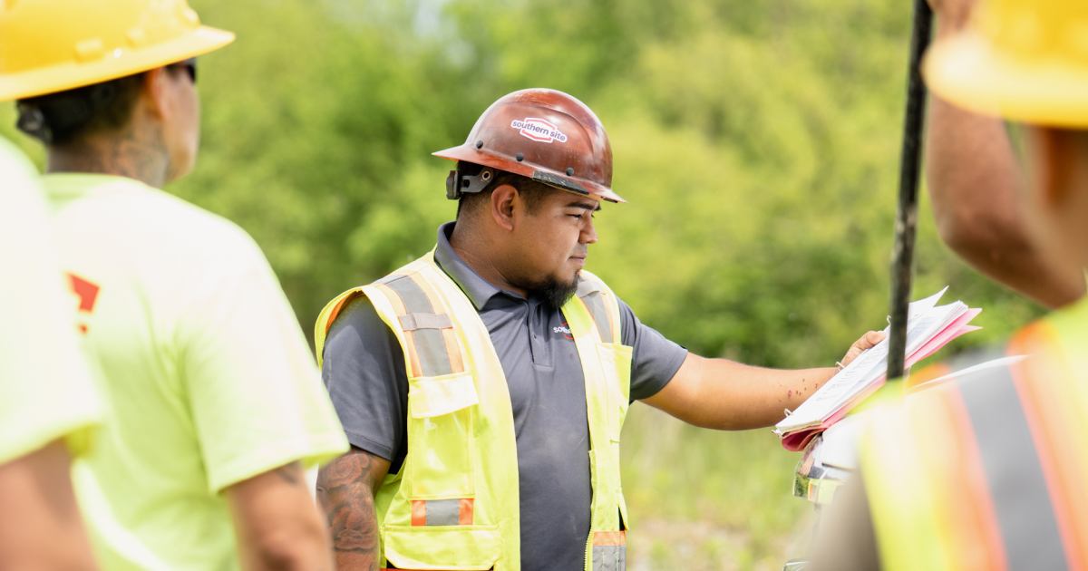 Man wearing safety vest and hard hat